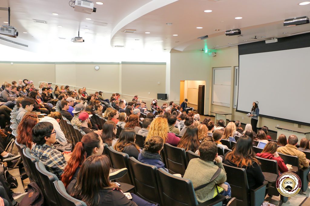 Dr. Proudfit lecturing in a lecture hall